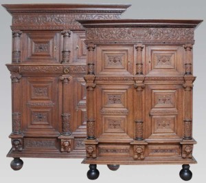 One of a pair of massive oak cupboards extremely fine carved, the front of the cupboards are decorated with classical pillars with Ionian tops and Doric bases.